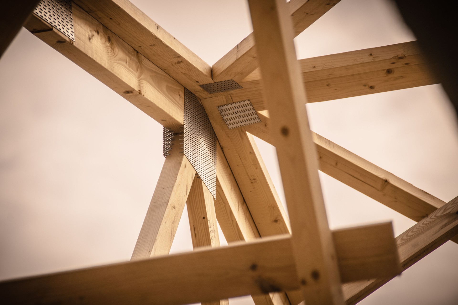 Intricate Wooden Framework Under Construction with Visible Joinery Techniques for Architectural Design and Engineering Insights